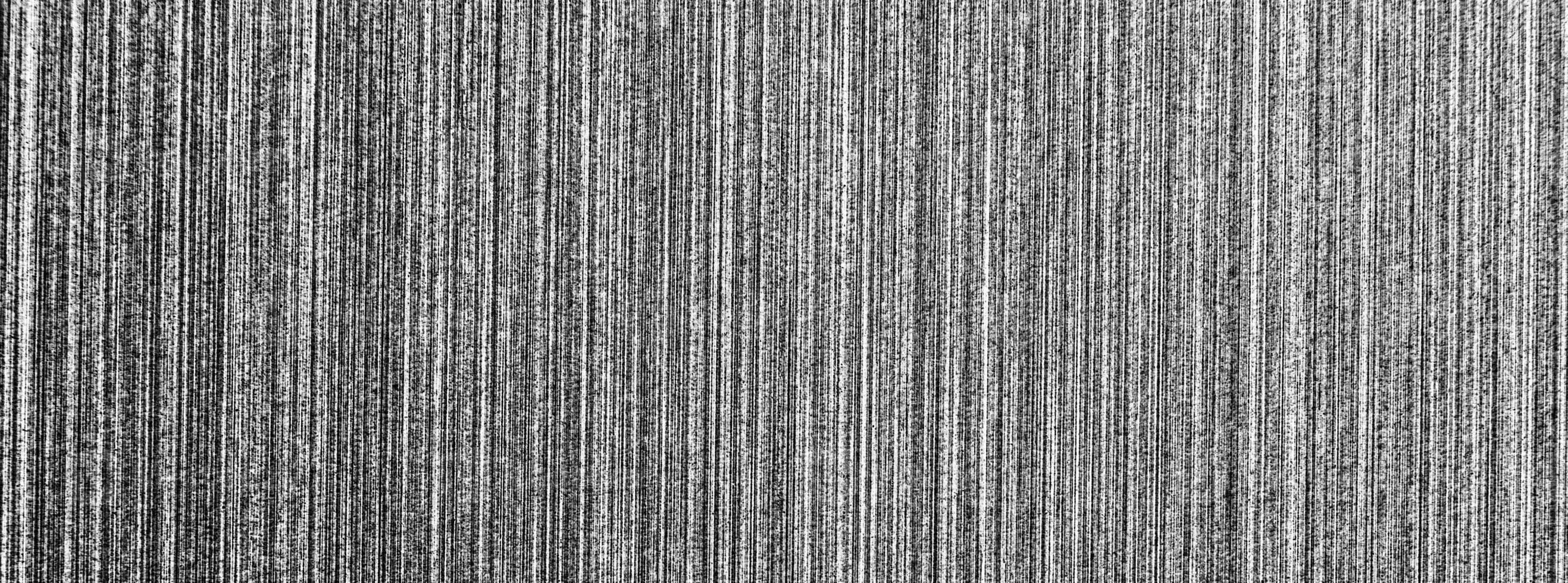 Metal texture with white scratches. Abstract noise black background overlay for design. photo