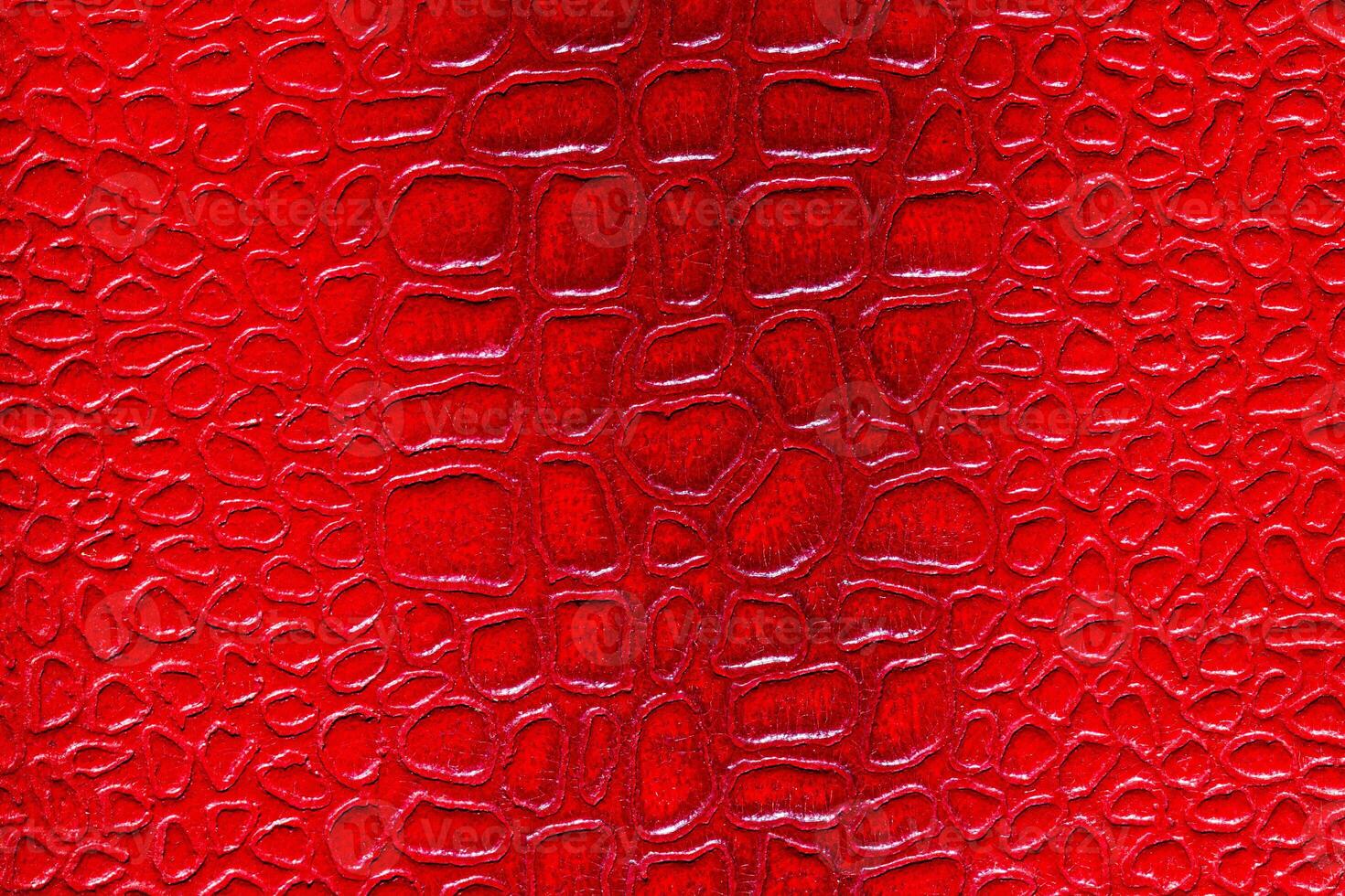 Red synthetic leather texture. Abstract background for design. photo