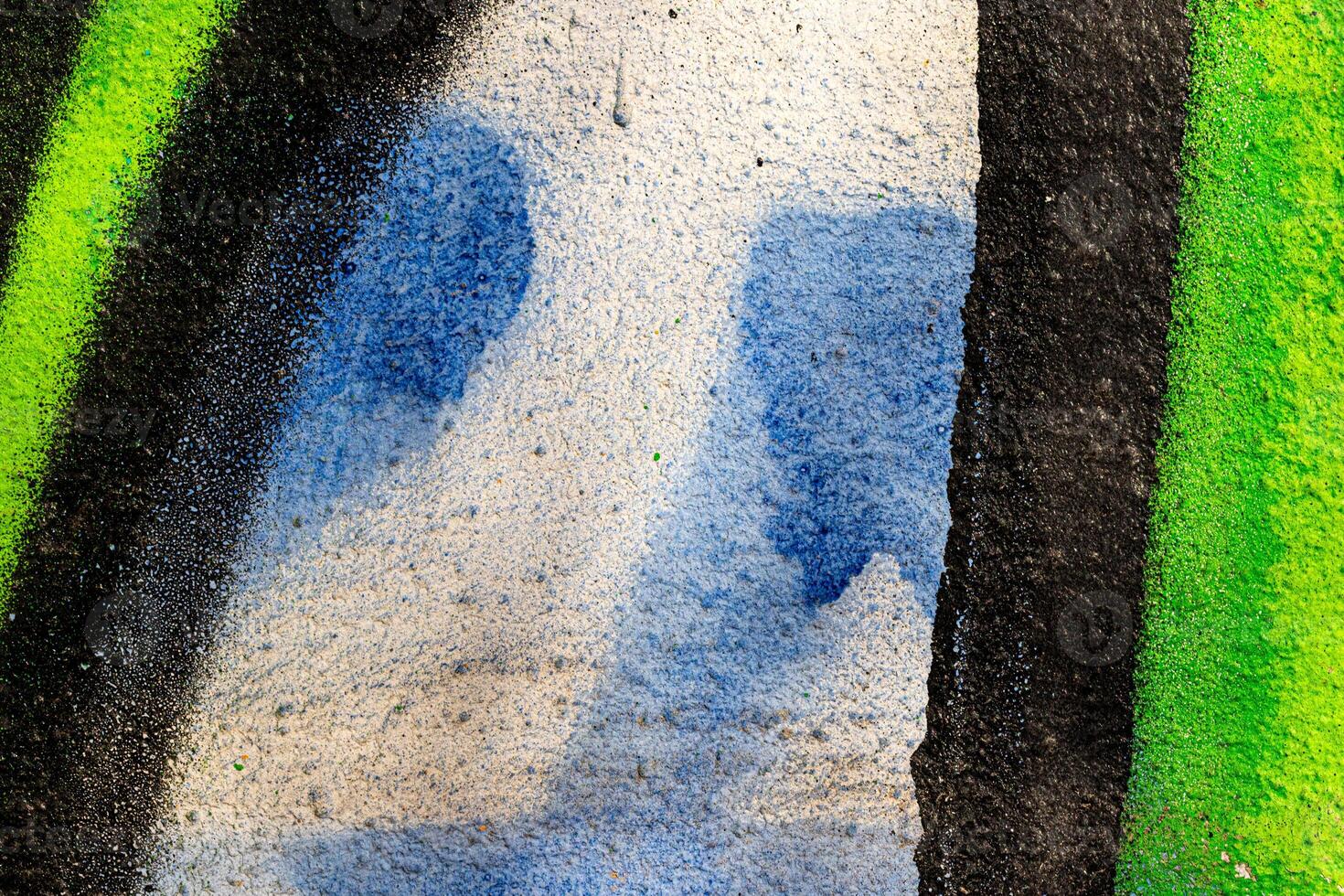 Fragment of colored graffiti painted on a wall. Bright abstract background. photo