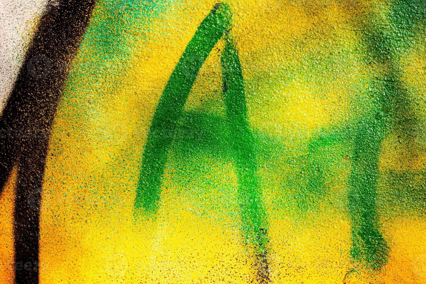 Fragment of colored graffiti painted on a wall. Bright abstract background. photo