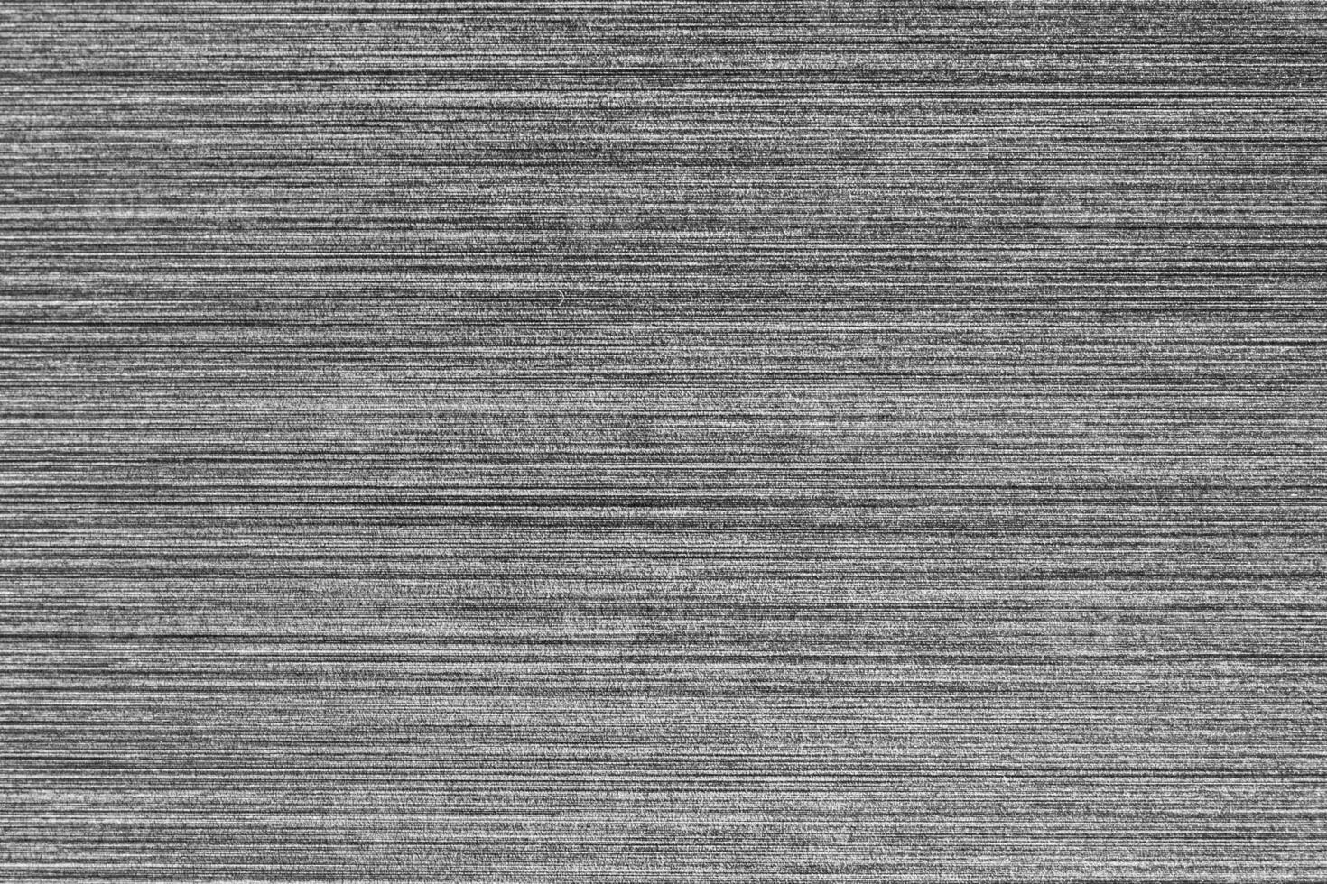 Silver metal texture with white scratches. Abstract noise black background overlay for design. photo