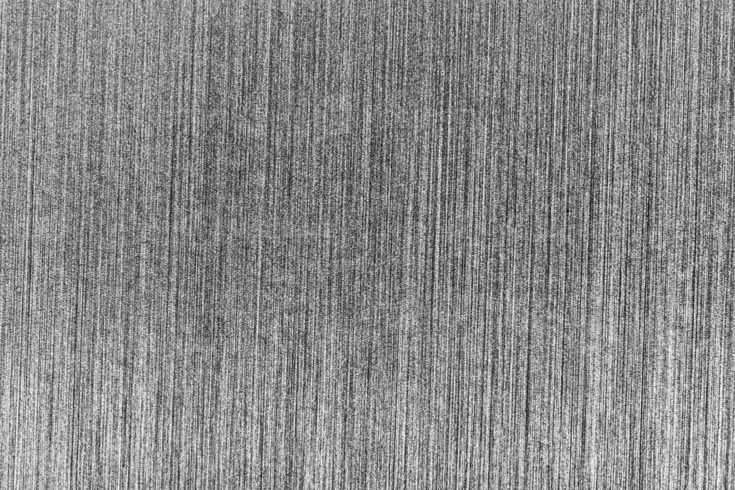 Silver metal texture with white scratches. Abstract noise black background overlay for design. photo