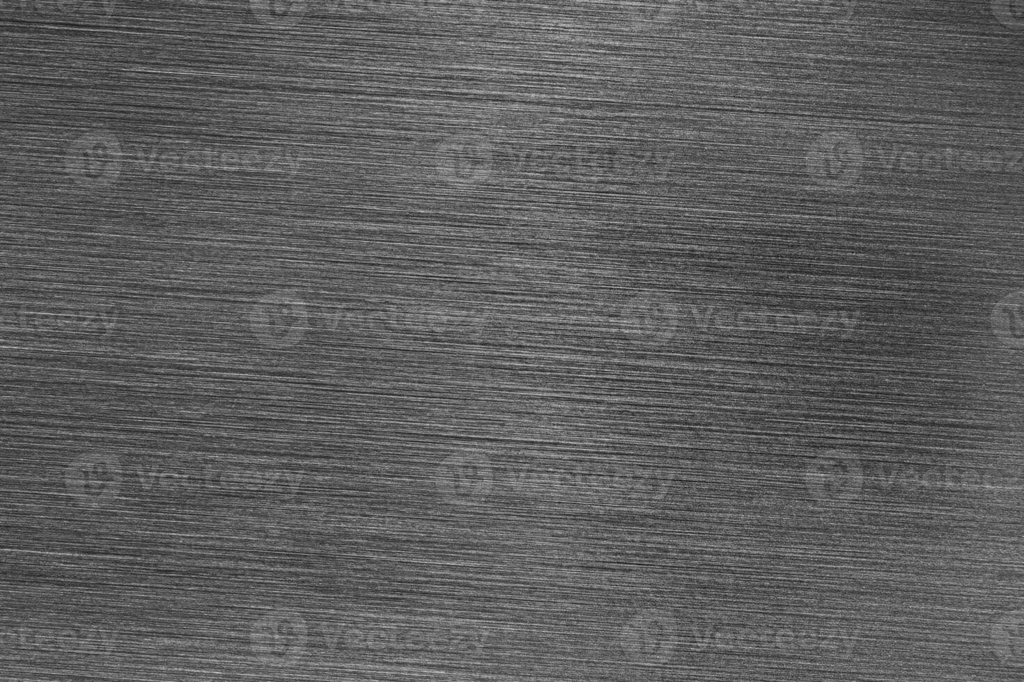Silver metal texture with white scratches. Abstract noise black background overlay for design. photo