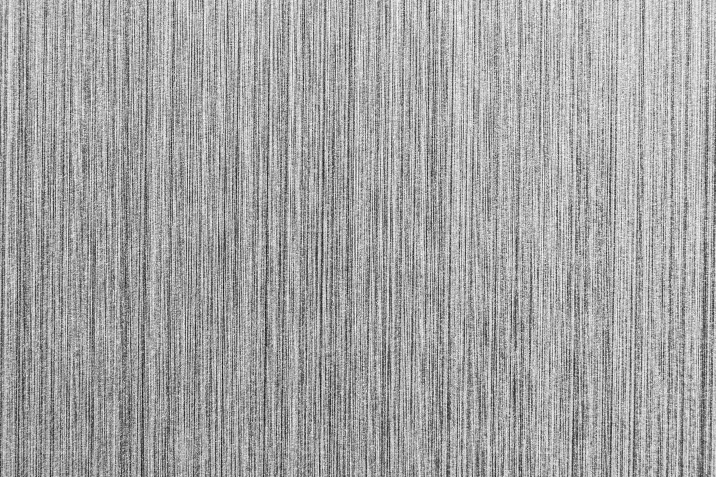 Silver metal texture with white scratches. Abstract noise black background overlay for design. photo
