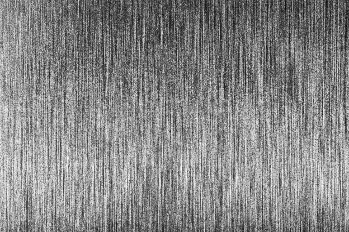 Silver metal texture with white scratches. Abstract noise black background overlay for design. photo
