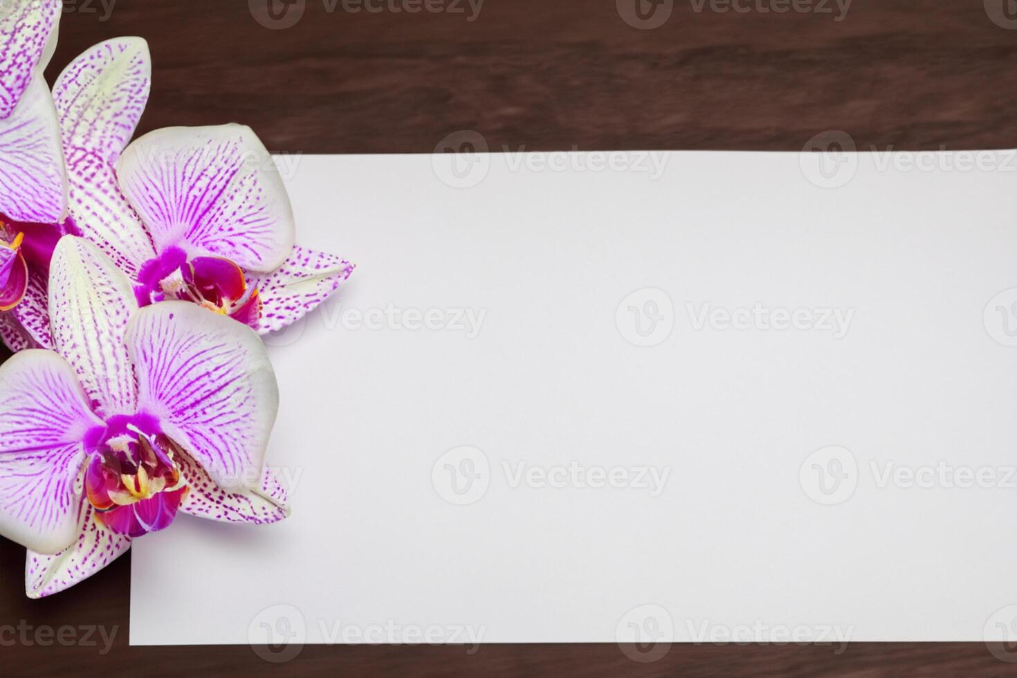 The mockup of a beautiful pink orchid on blank paper showcases a delicate and elegant floral design. photo
