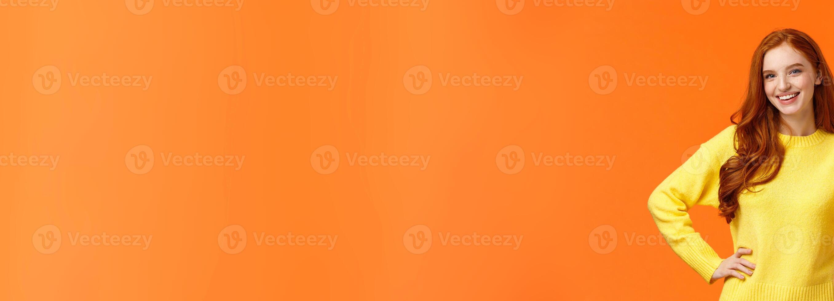 Sounds good, count me in. Waist-up shot cheerful upbeat girl make thumb-up gesture and smiling in approval, like idea, recommend consumer nice product, standing orange background photo