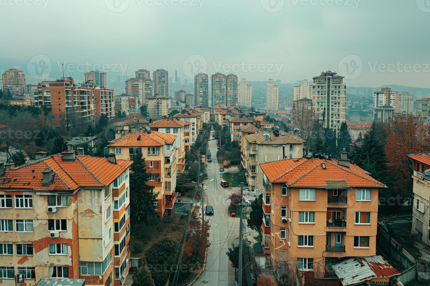 Cityscape with tall buildings viewed from above under cloudy daytime sky photo