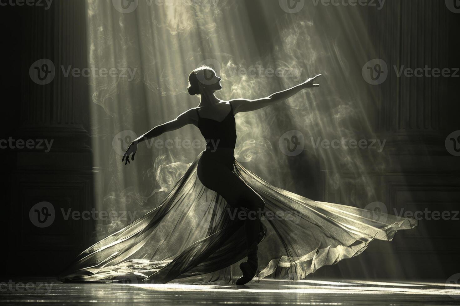 A woman wearing a black dress is dancing gracefully in the dimly lit room photo