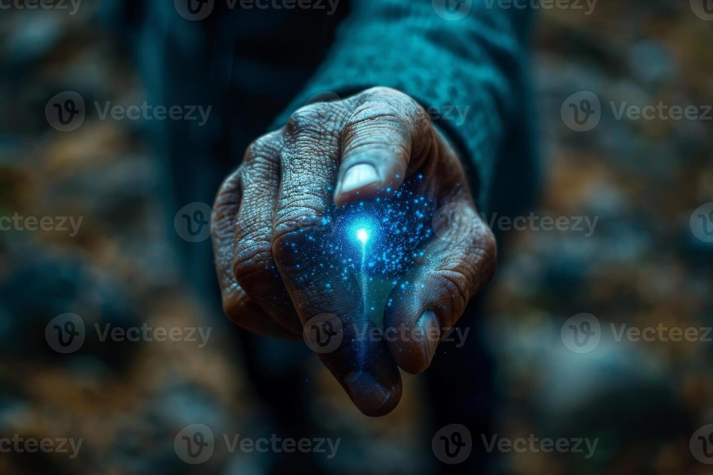 Hand holding glowing magical light, enchanted forest setting, mystical power concept photo
