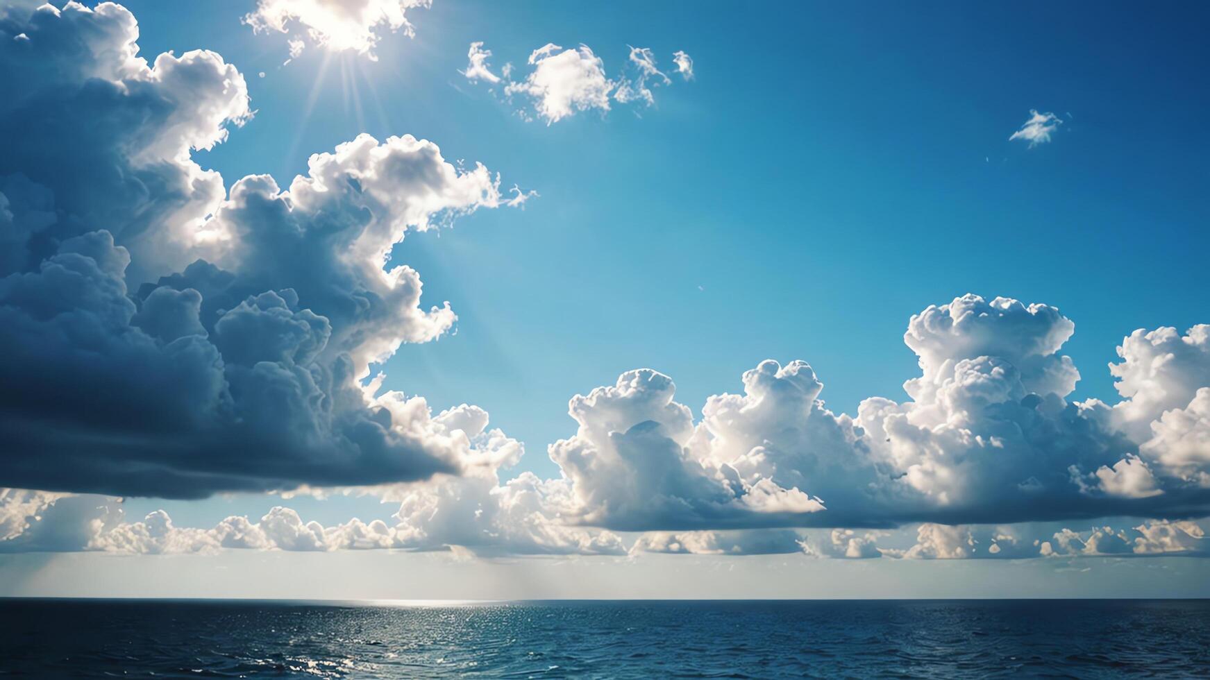 the sun shines over the ocean and clouds photo