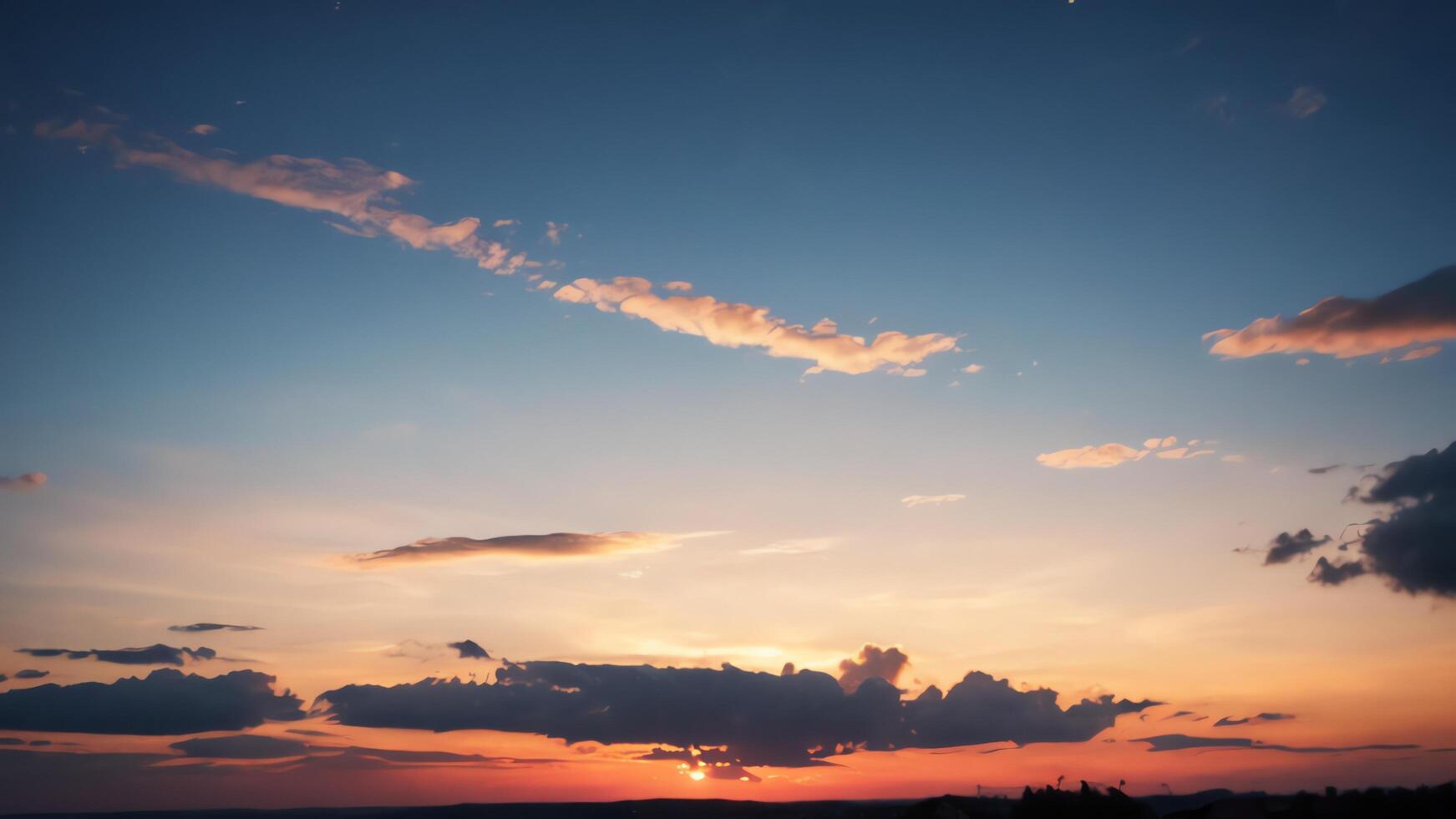 view of the sky with the orange light of the sun photo