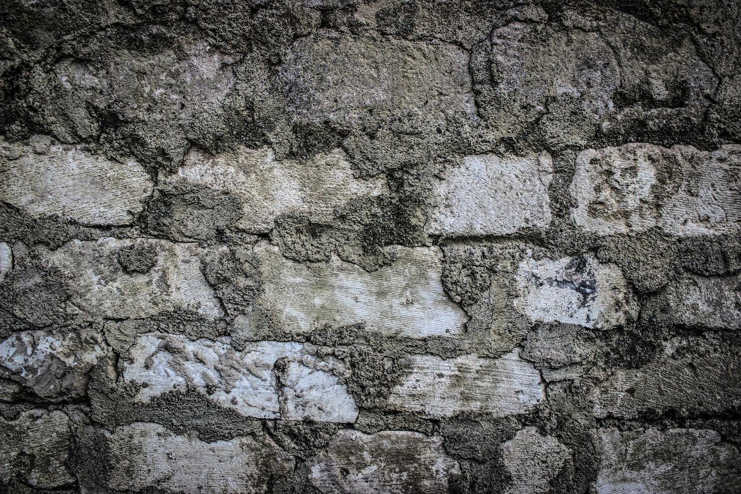the texture of an old white brick masonry with remnants of plaster photo