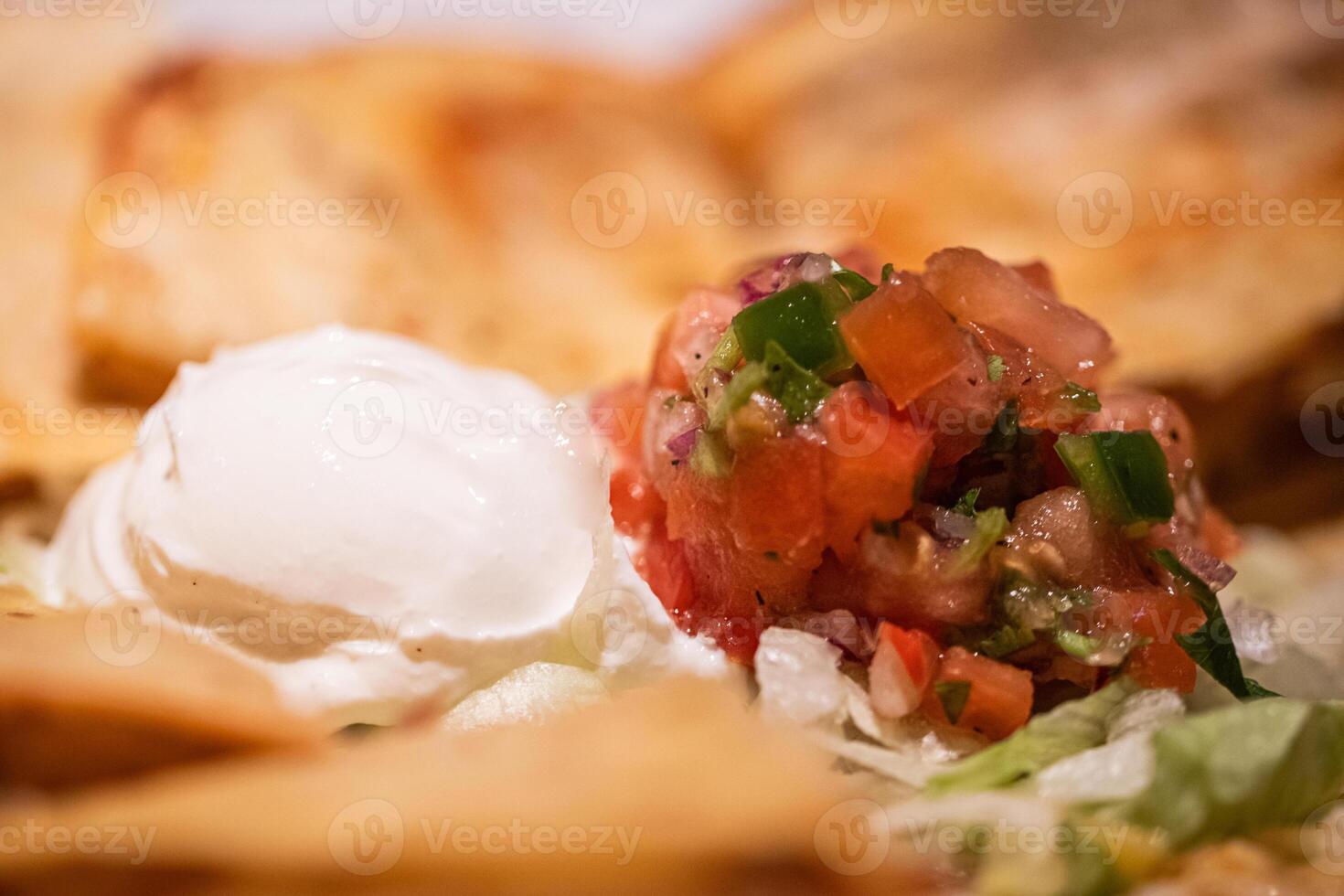 Sour cream and pico de gallo photo