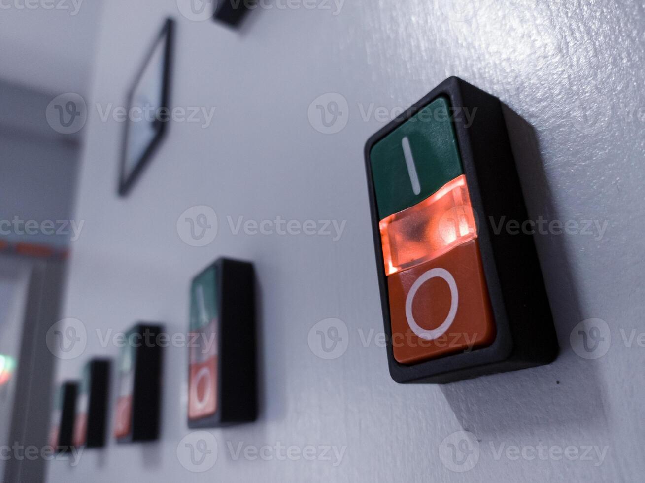 ON-OFF Switches with indicator light on in electrical panel control. photo