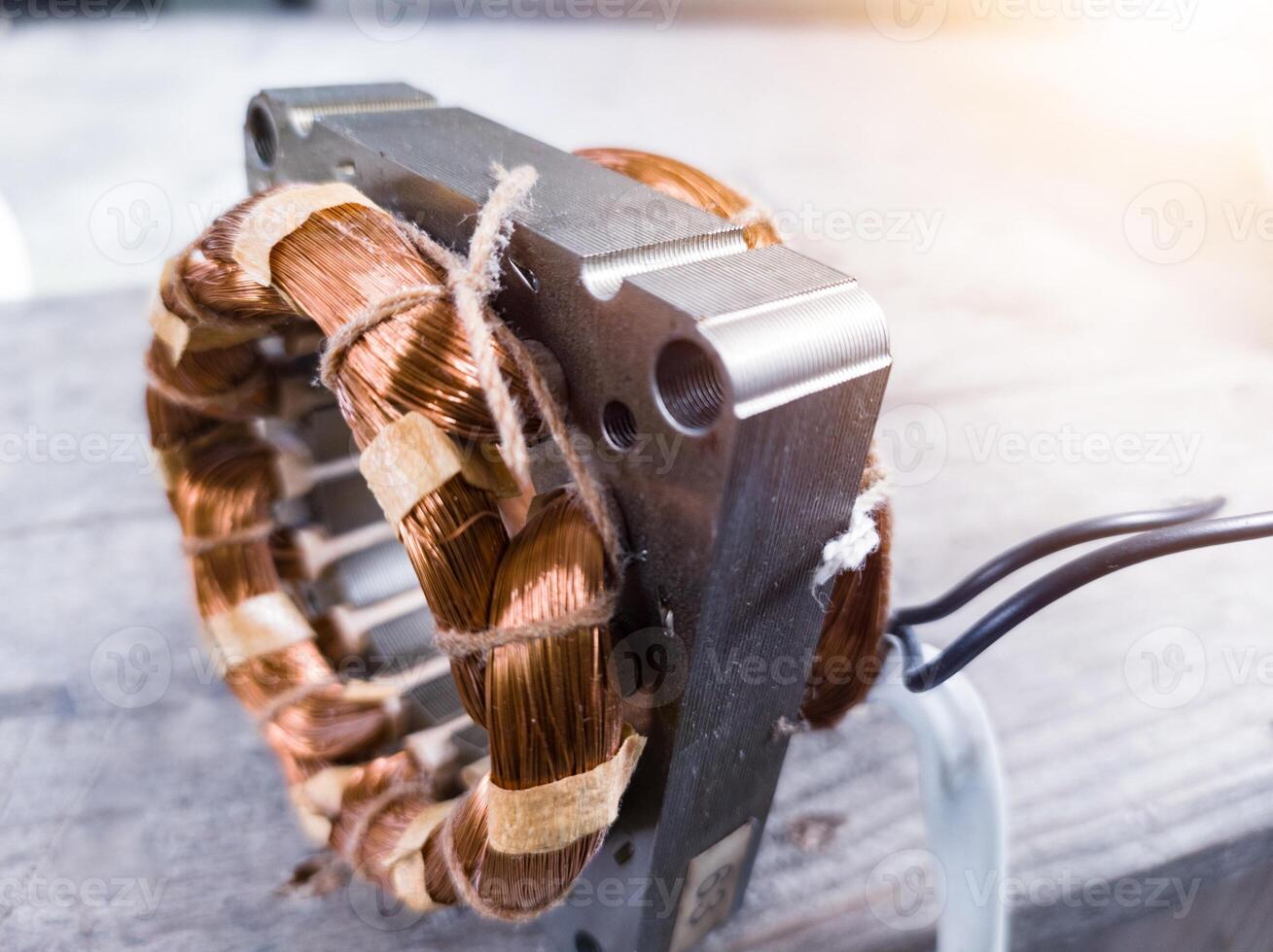 Electric motor winding coil , three phase induction motor winding coil assembly, procedure for replacing.With shiny light. photo