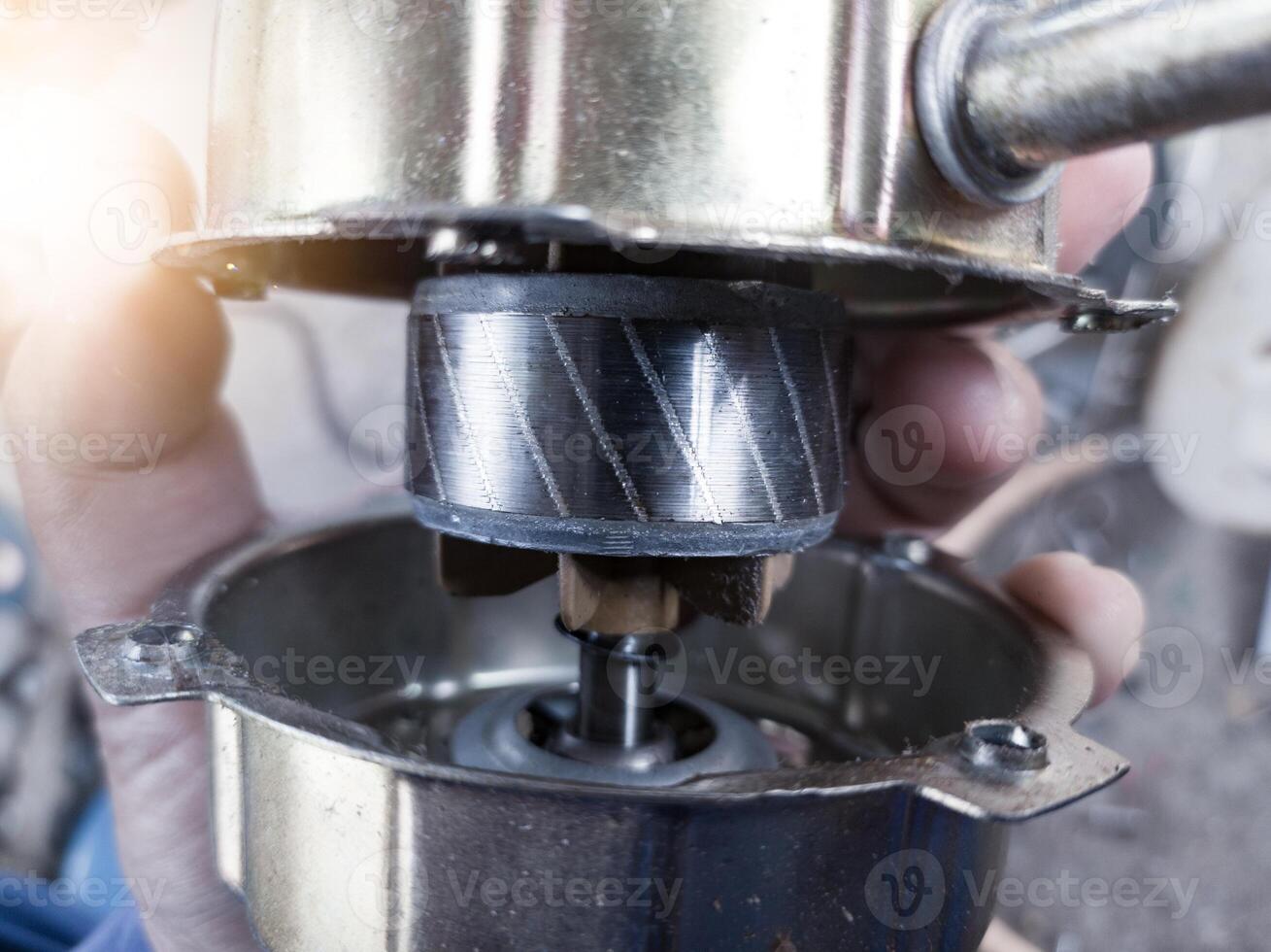 Checking the rotor on the cooling fan winding housing. photo