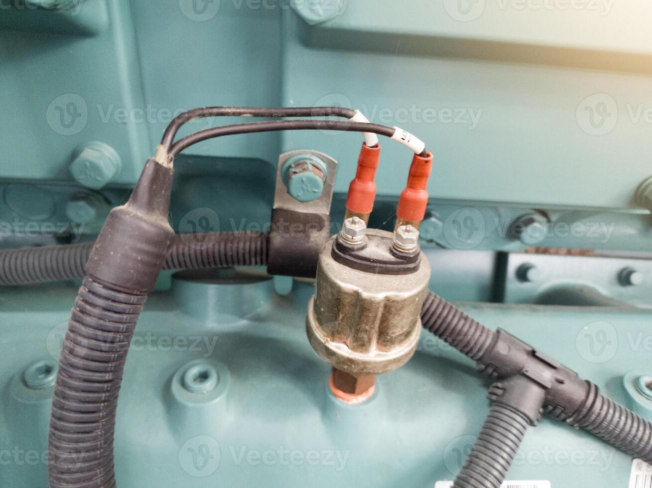 Pressure switch oil sensor on the electrical engine system. photo