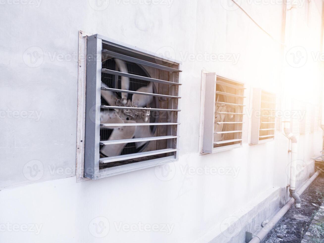 Big industrial Exhaust fan in a factory. Ventilation of plant building. With Shiny light. photo