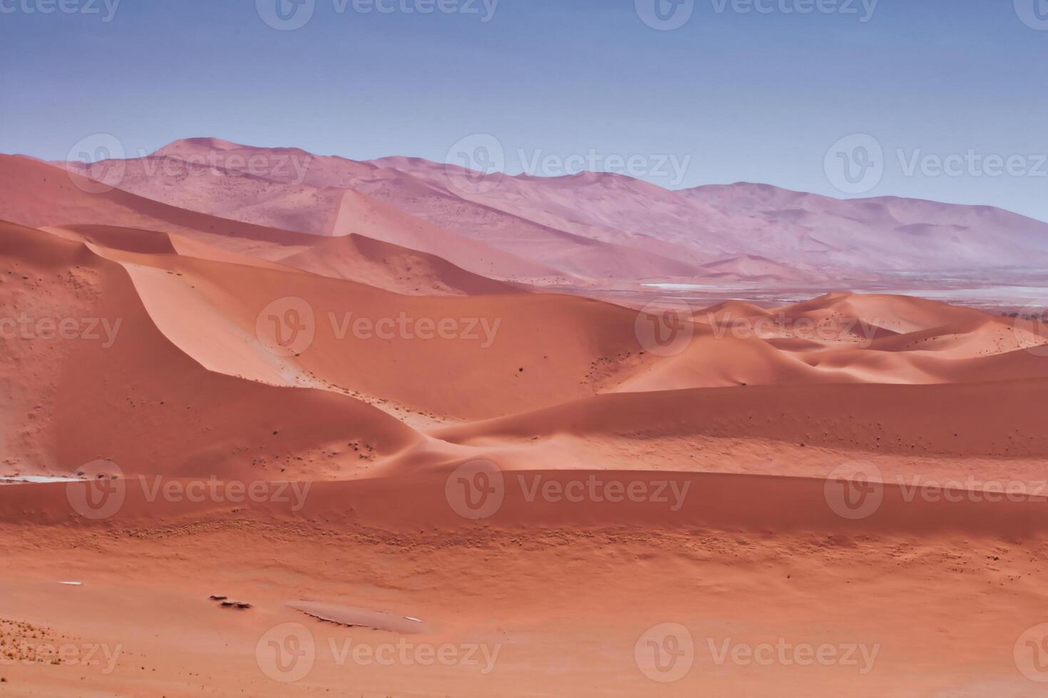 Horizontal shot of the sand dunes in the namibian desert of Sossusvlei photo