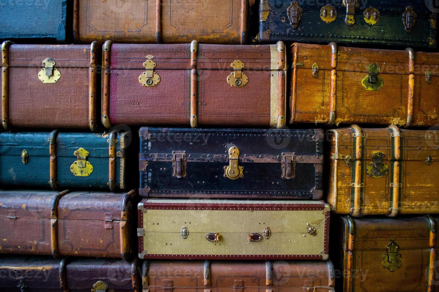 Stacked vintage travel suitcases and luggage photo