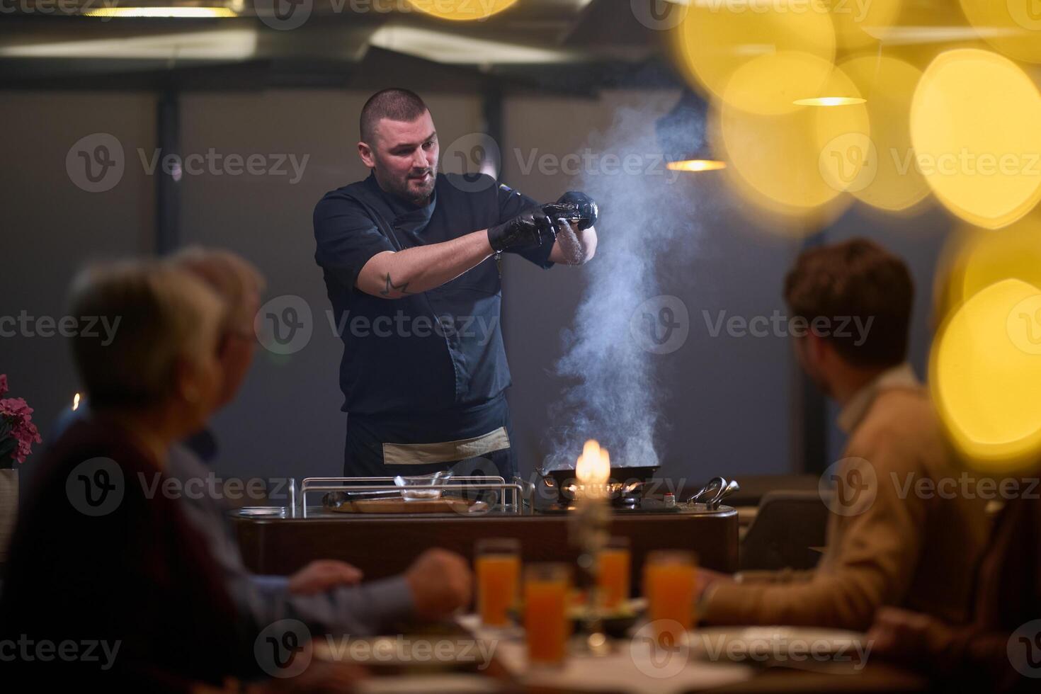 In a restaurant setting, a professional chef presents a sizzling steak cooked over an open flame, while an European Muslim family eagerly awaits their iftar meal during the holy month of Ramadan photo