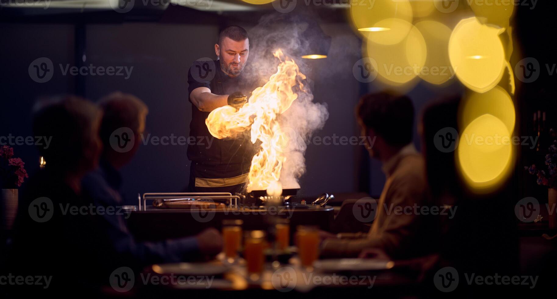 In a restaurant setting, a professional chef presents a sizzling steak cooked over an open flame, while an European Muslim family eagerly awaits their iftar meal during the holy month of Ramadan photo