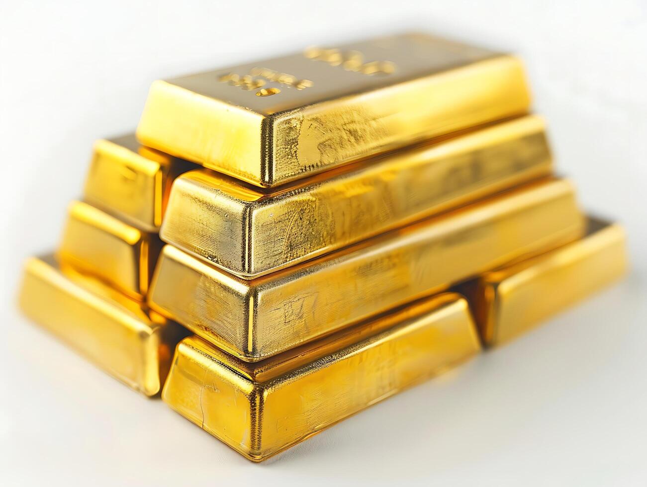 Stacks of gold bars on white background photo