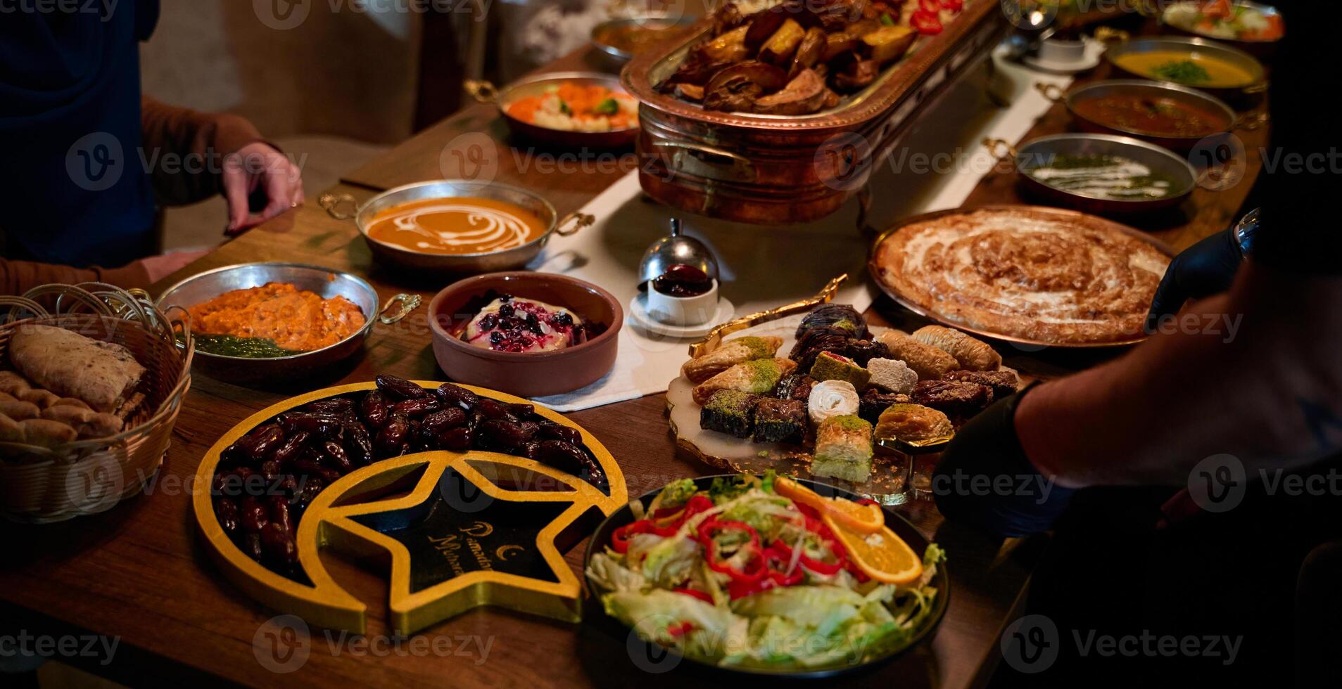 In this captivating aerial view, delicious food adorned with Ramadan decorations, including dates and meat, awaits the arrival of an European Islamic family, promising a festive and flavorful iftar photo