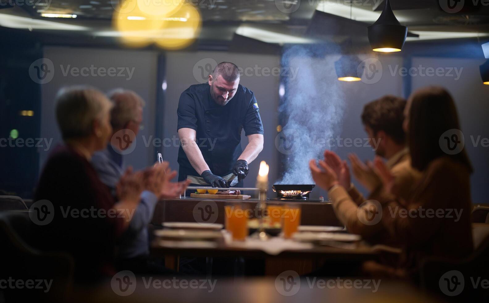 In a restaurant setting, a professional chef presents a sizzling steak cooked over an open flame, while an European Muslim family eagerly awaits their iftar meal during the holy month of Ramadan photo