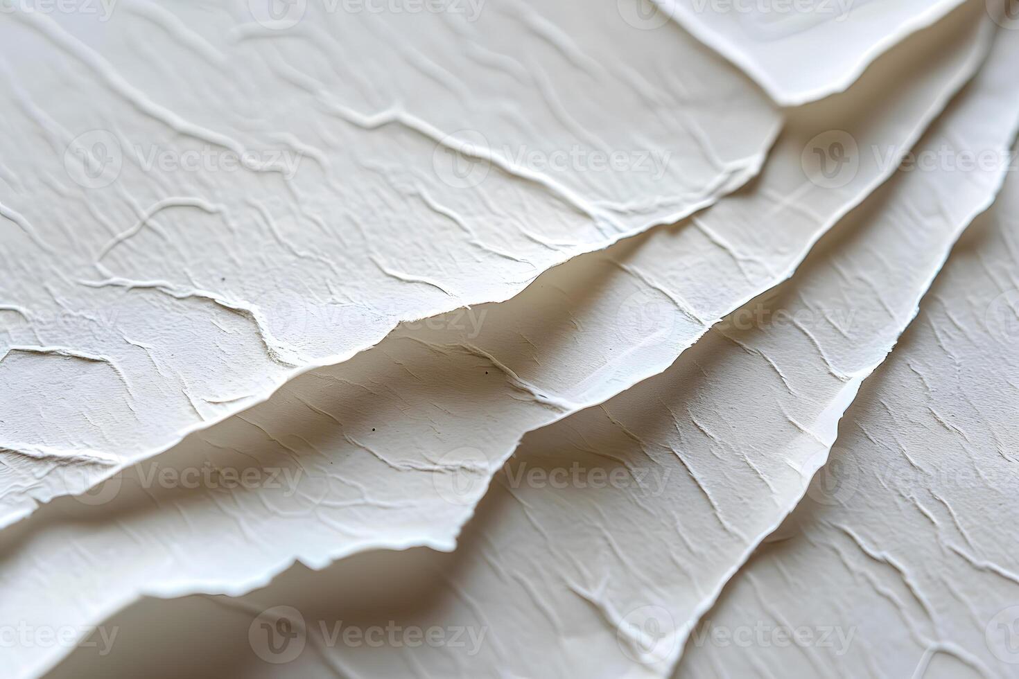 White paper cut and folded into various shapes photo