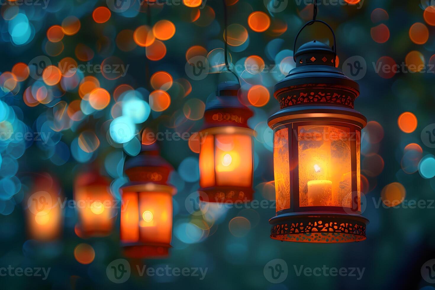 Many lanterns hanging from a tree with lights in the background photo