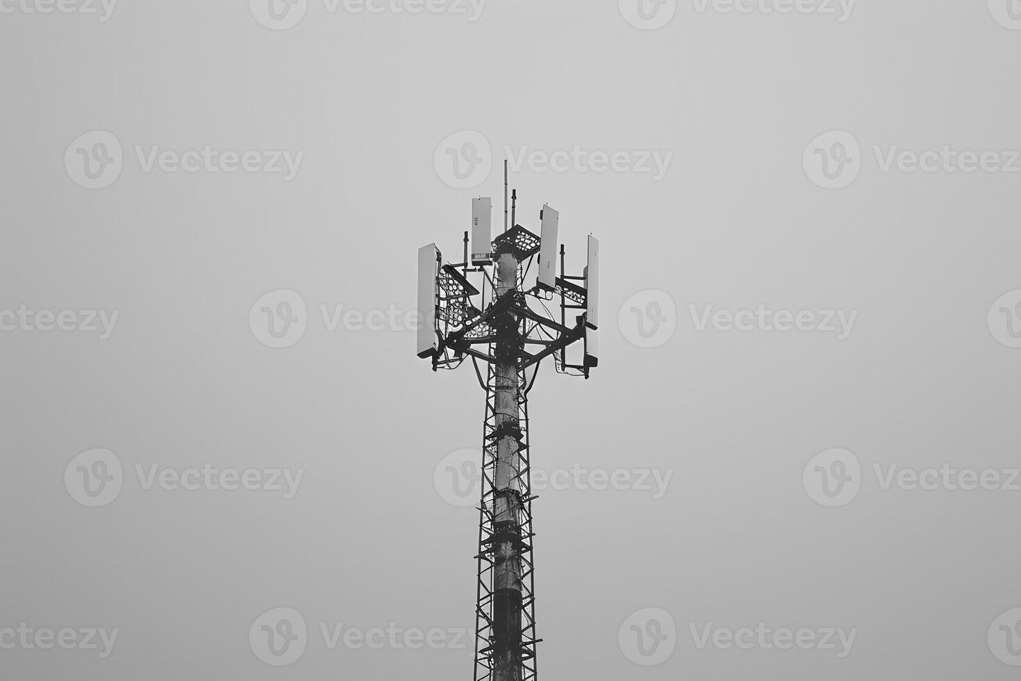 Cell tower with multiple antennas on top photo