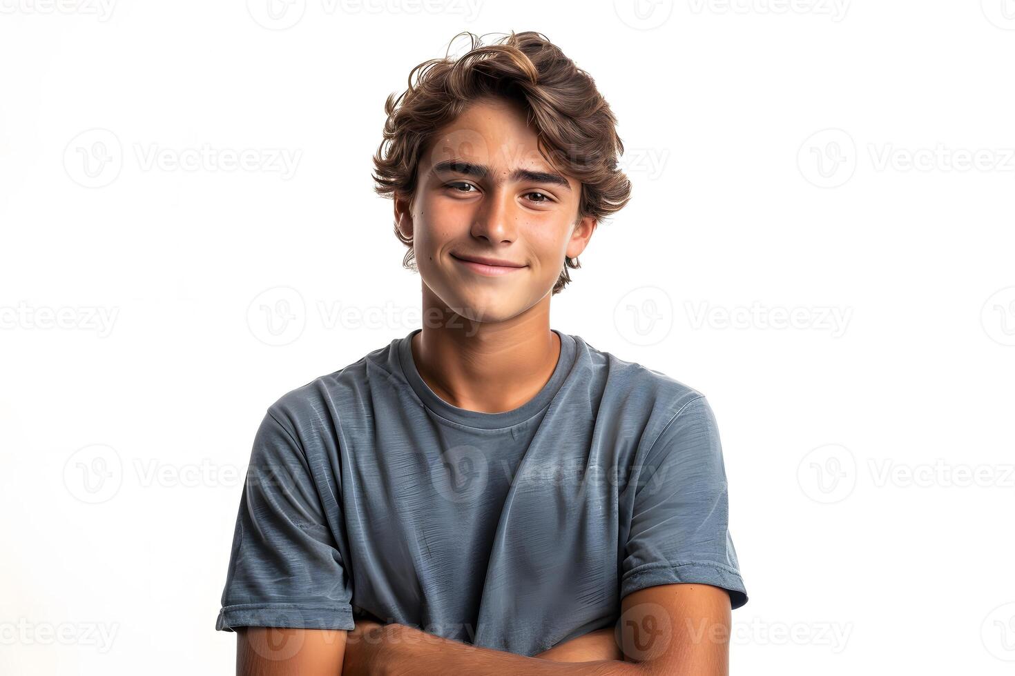 Young man smiling with arms crossed photo