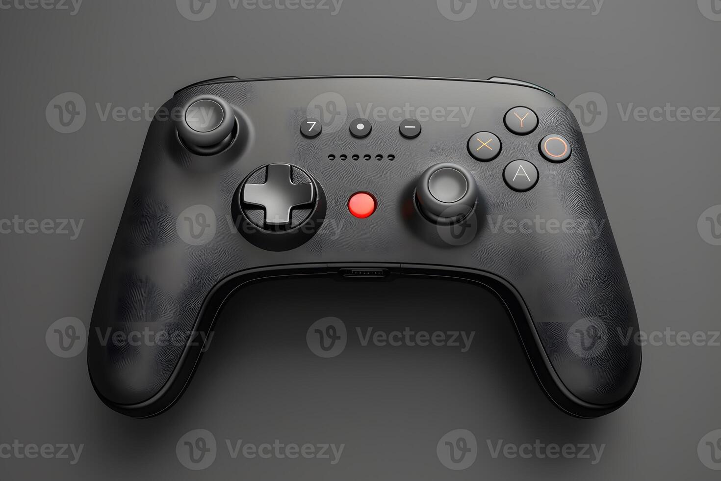 A black game controller with red buttons on a grey surface photo