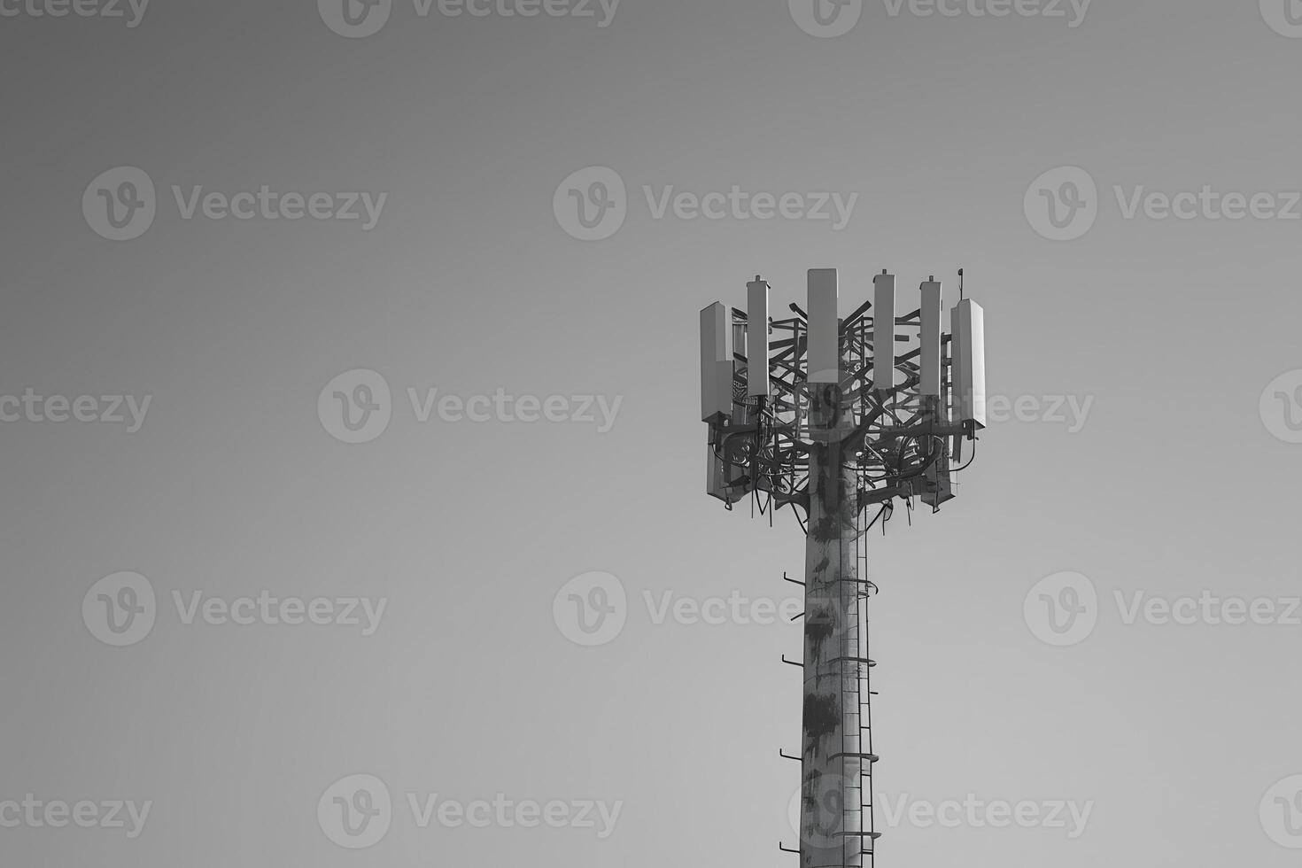 Cell tower with multiple antennas on top photo