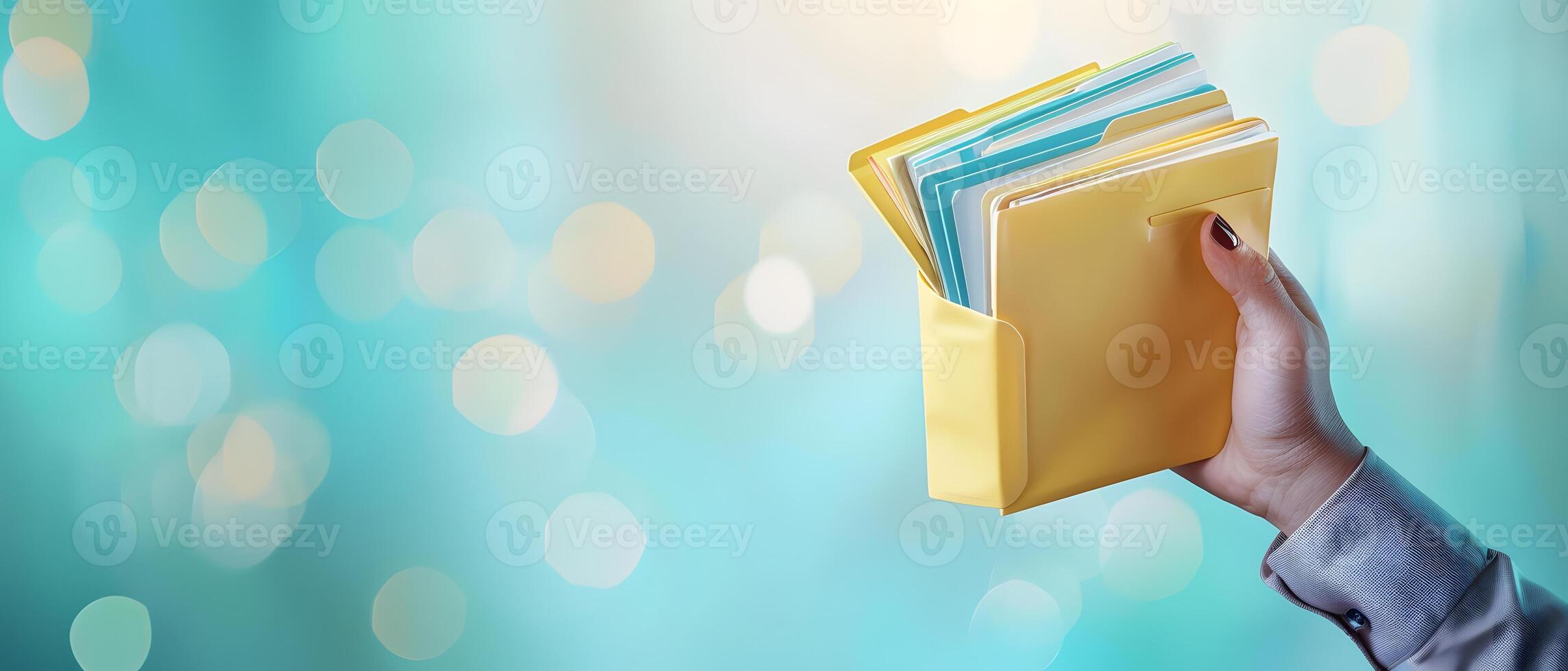 Person holding thick file folder photo