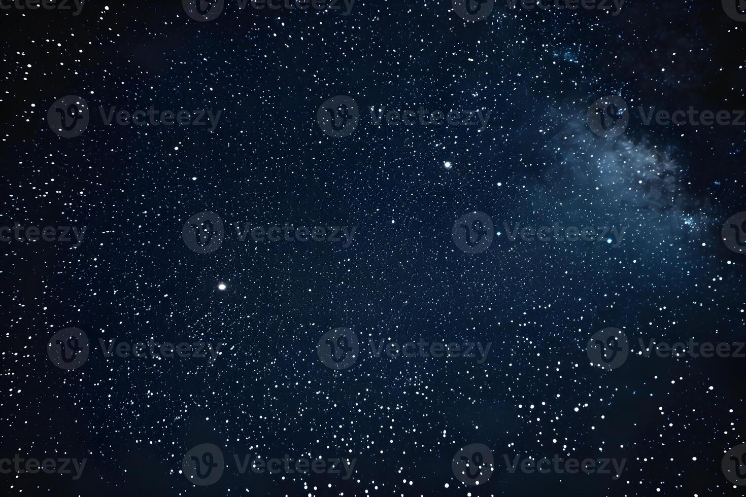 Close-up of a starry sky with a few clouds photo
