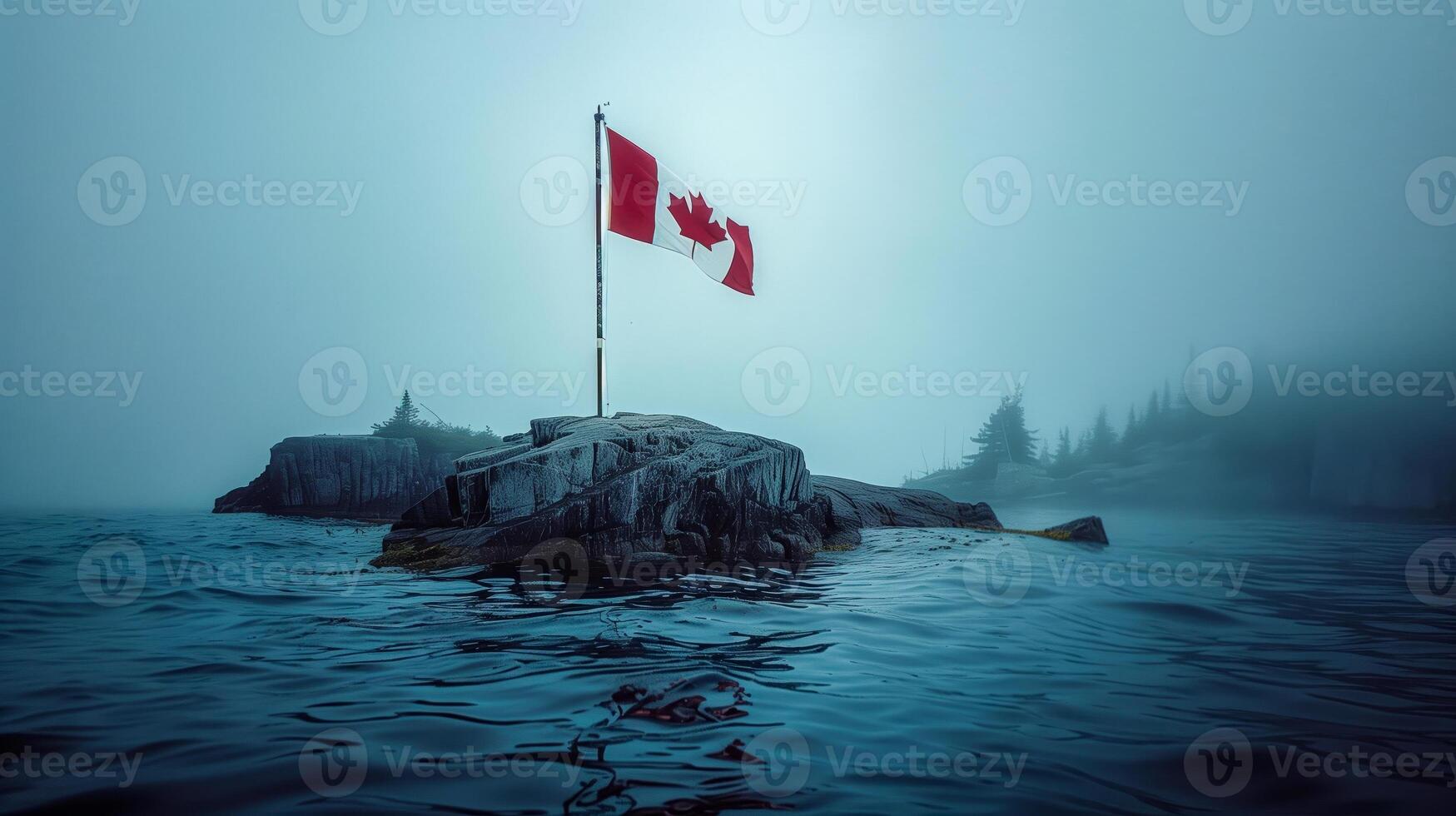 Canadian flag flutters in the middle of a rocky lake photo