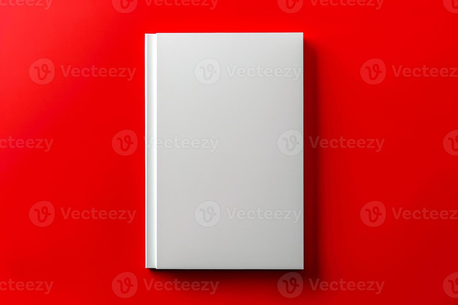 Blank white book on red background photo