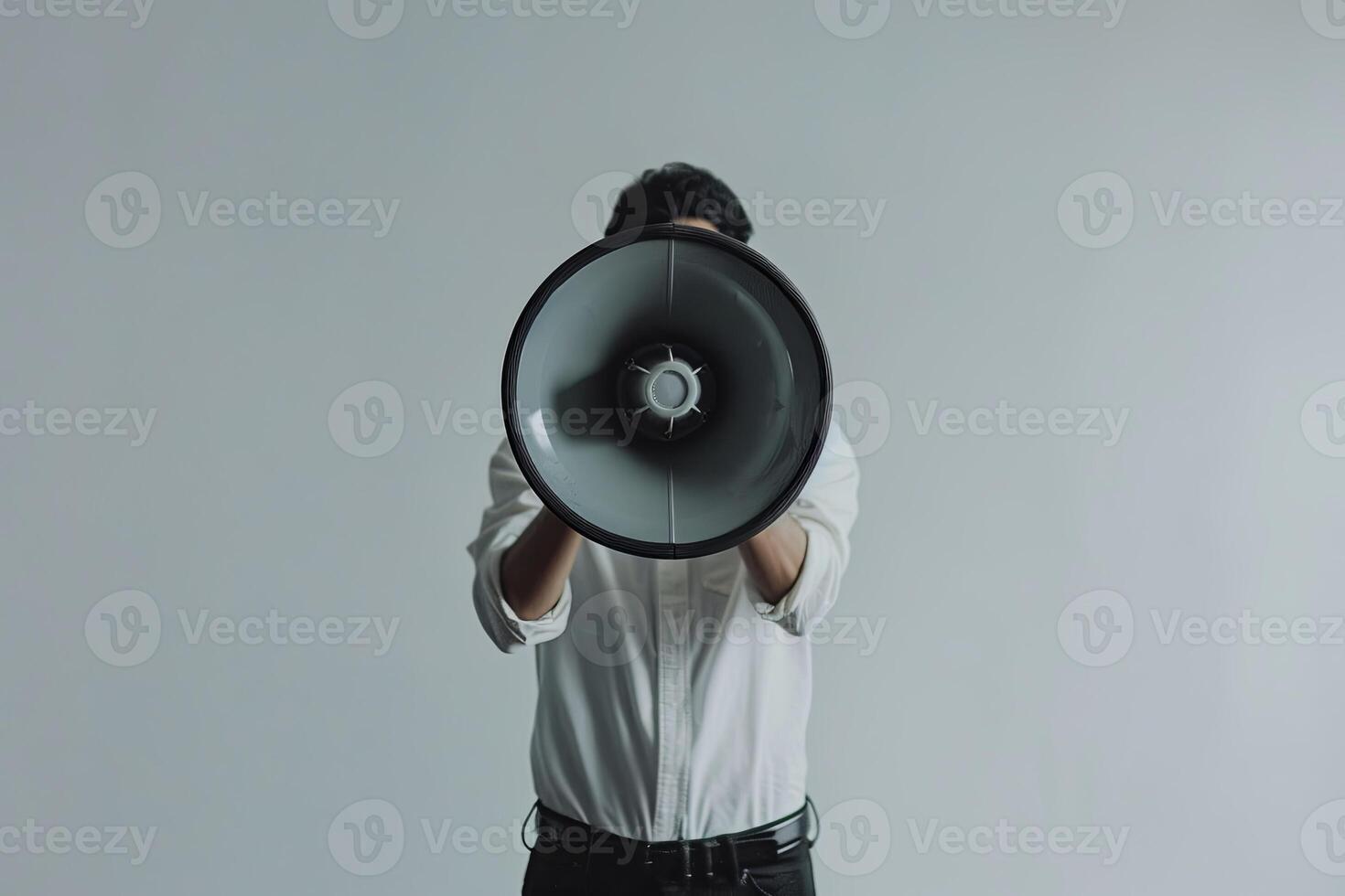 Individual with a megaphone against a grey background showcasing a neutral web banner idea photo