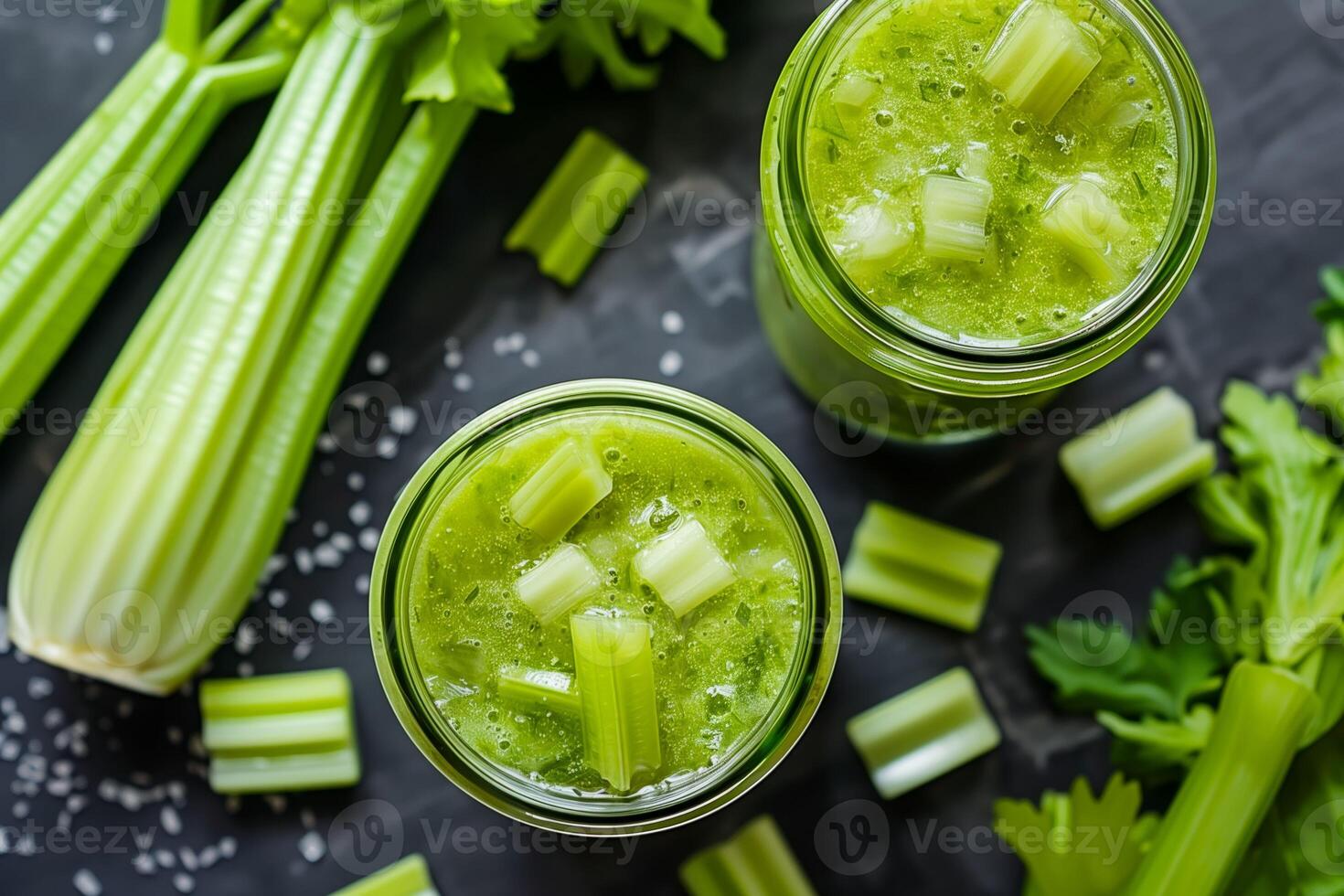 Two glasses of celery juice with celery stalks photo