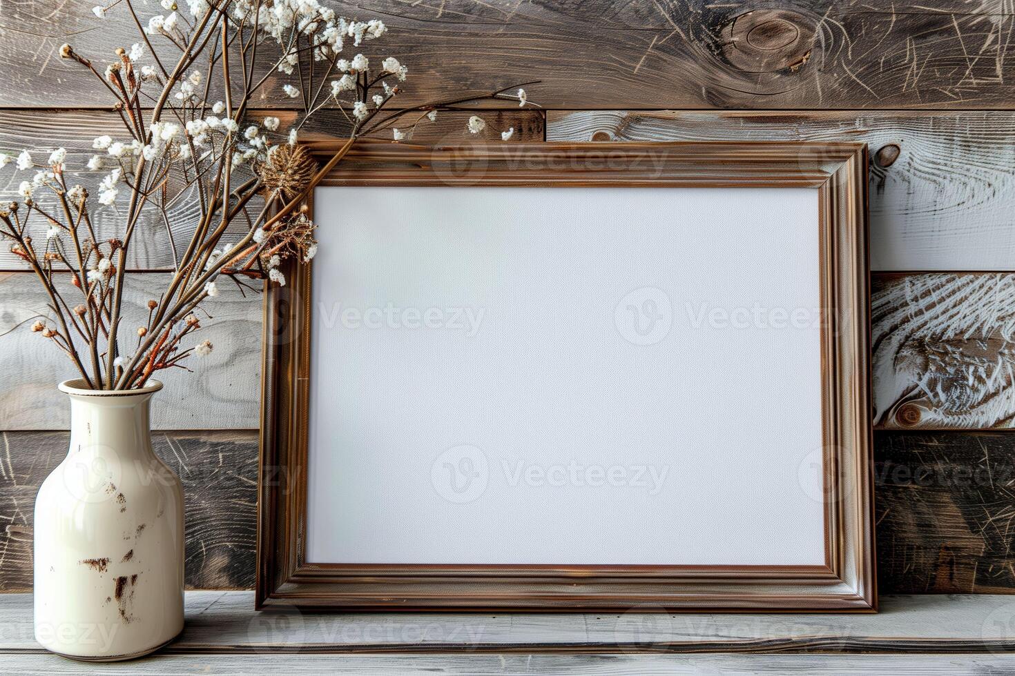 A picture frame displaying a photo beside a vase with flowers