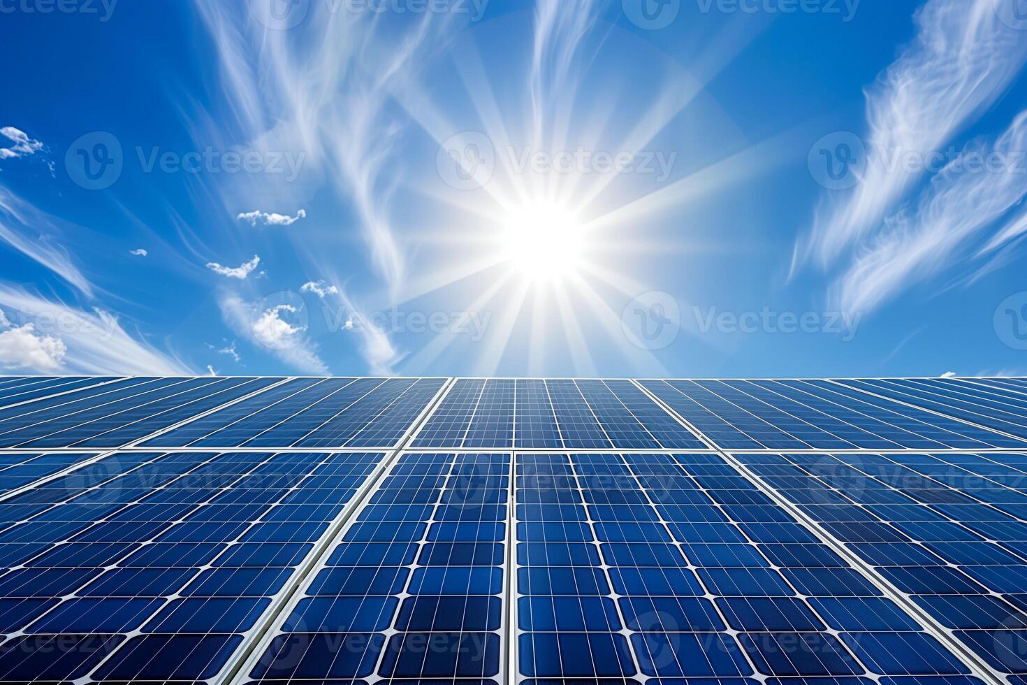 A close up of a solar panel with the sun shining photo