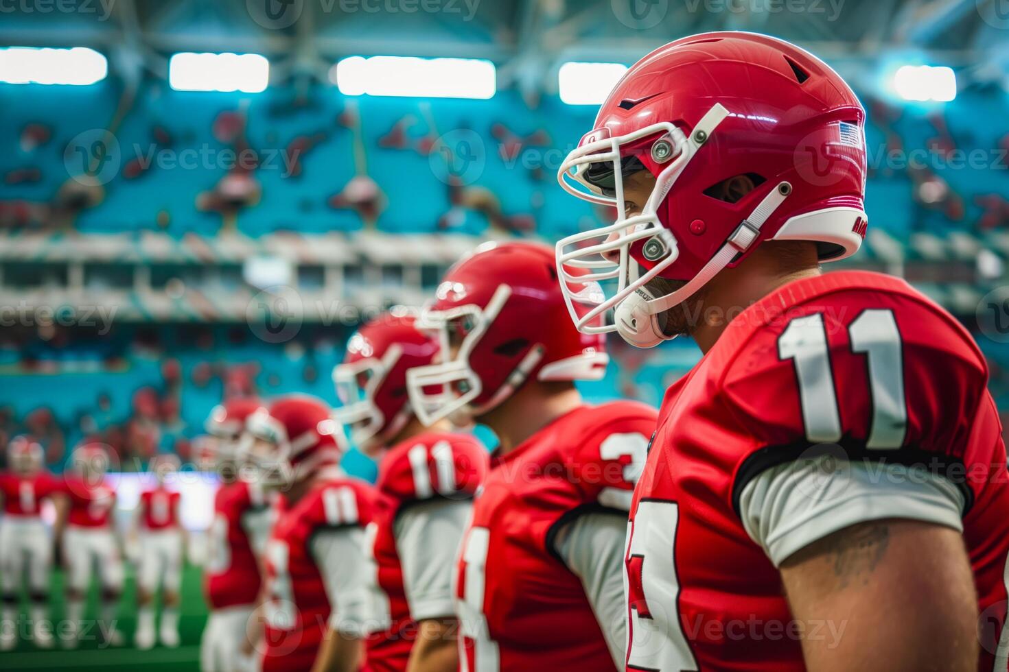 Football players in red uniforms stand in a row photo