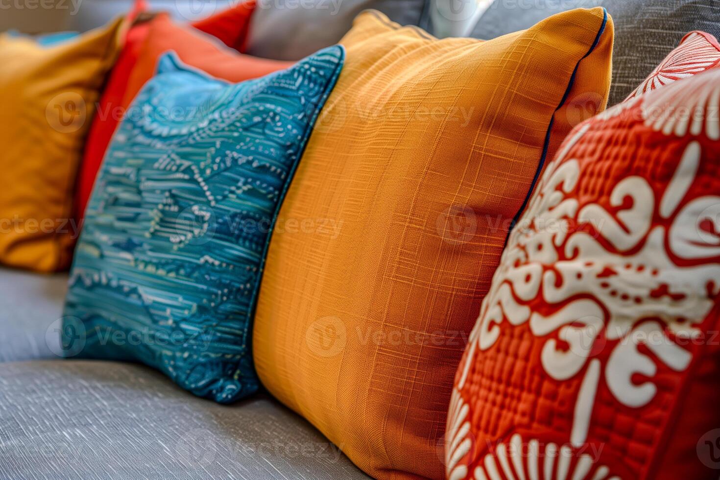 A close up of a couch with a bunch of pillows on it photo