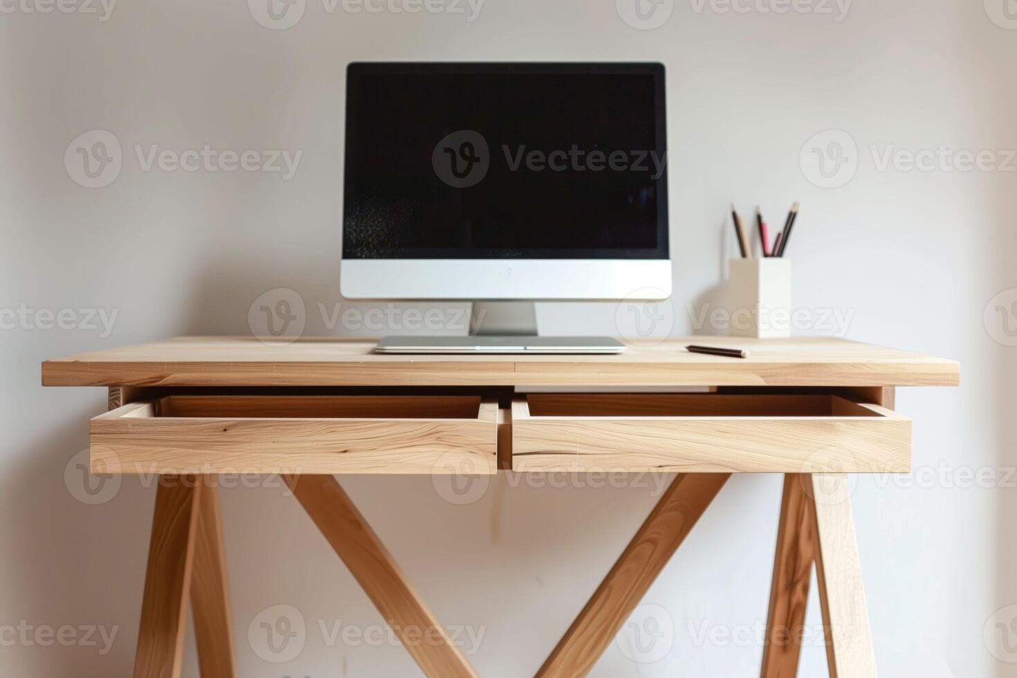 A computer on a wooden desk photo