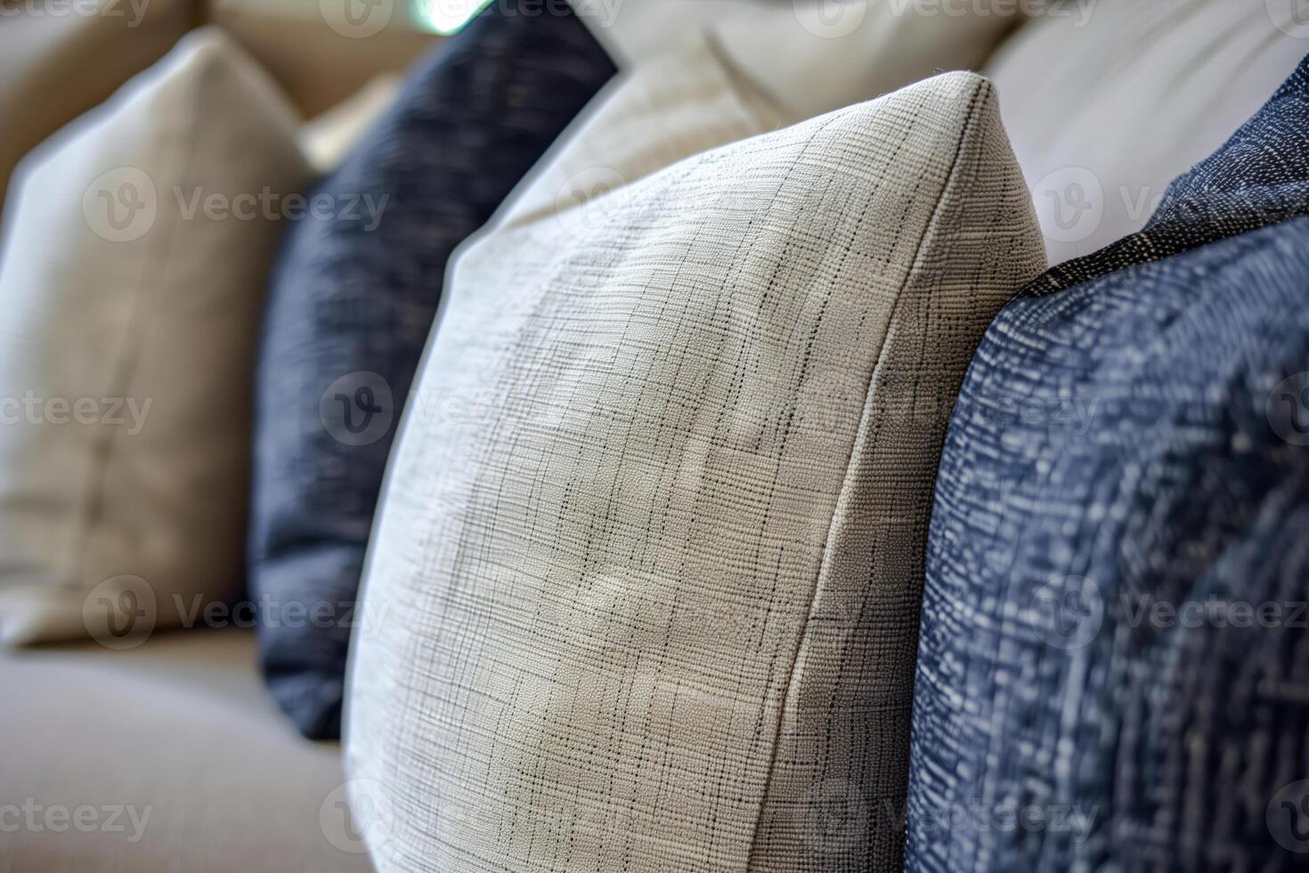 A close up of a couch with a bunch of pillows on it photo