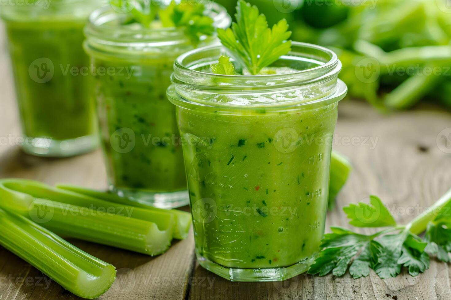 Two glasses of celery juice with celery stalks photo