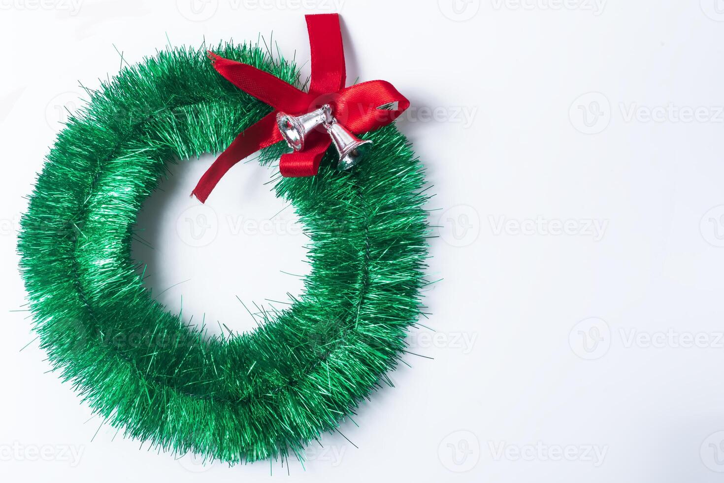 Christmas wreath with red bow isolated on white background photo